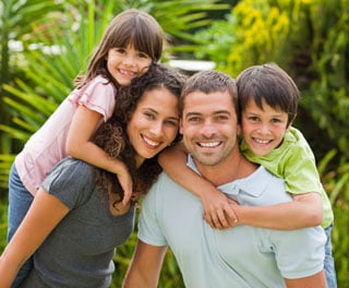 Smiling family of four