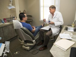 Dr. Willhide consulting with a patient